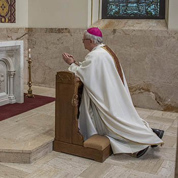 Bishop_Ricken_kneeling.jpg