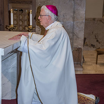 Bishop_Ricken_kneeling_2.jpg