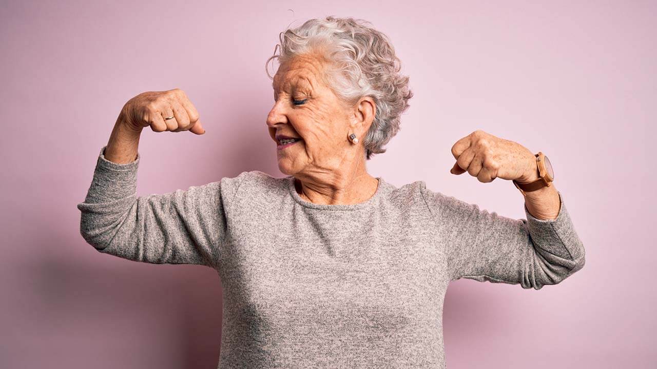 Elderly woman posing with arms bent