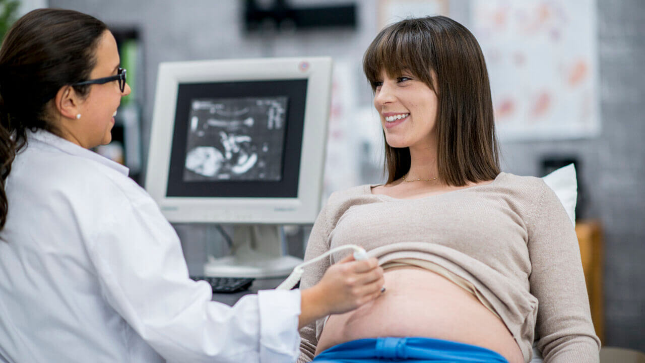 pregnant woman getting ultrasound