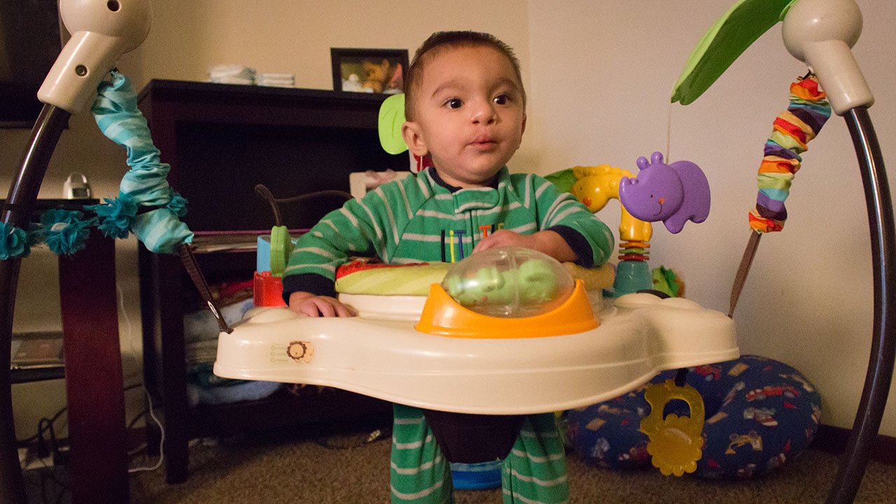 Baby Anthony playing in an interactive playset for toddlers