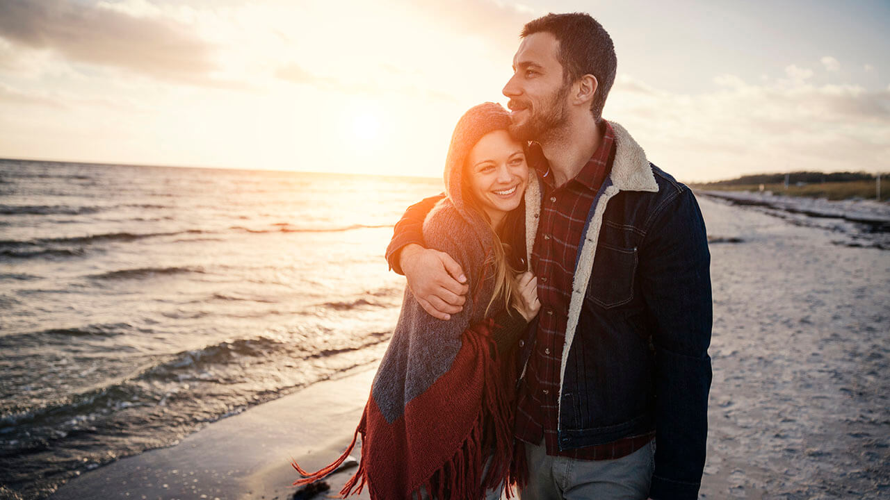 Couple hugging on a beach