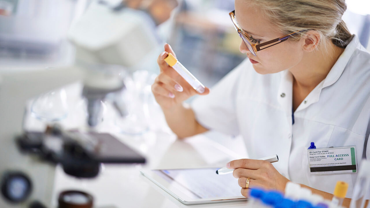 Medical Laboratory Scientist observing samples in a beaker