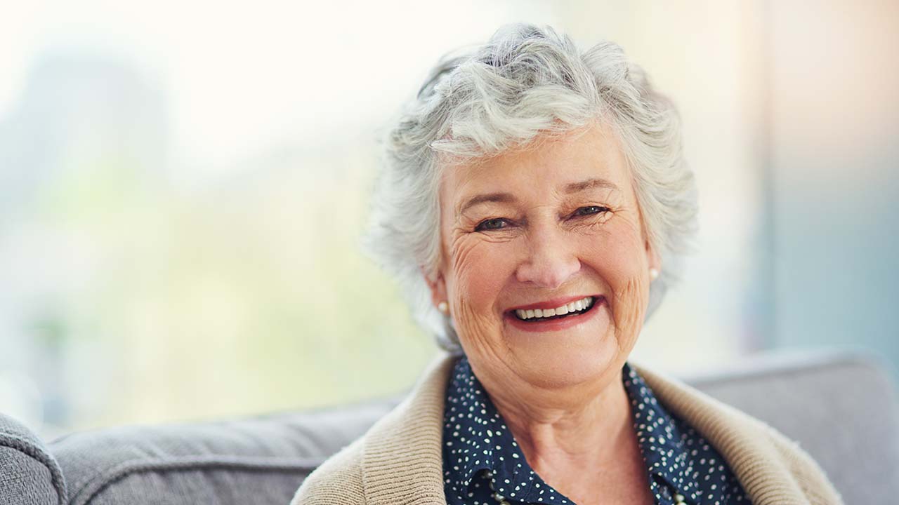 Elderly woman smiling at the camera