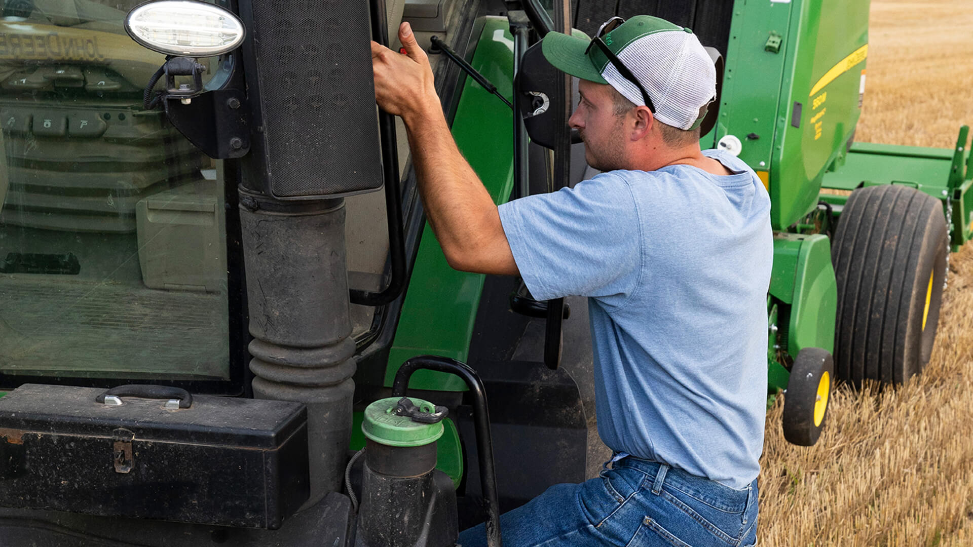 Man getting into tractor