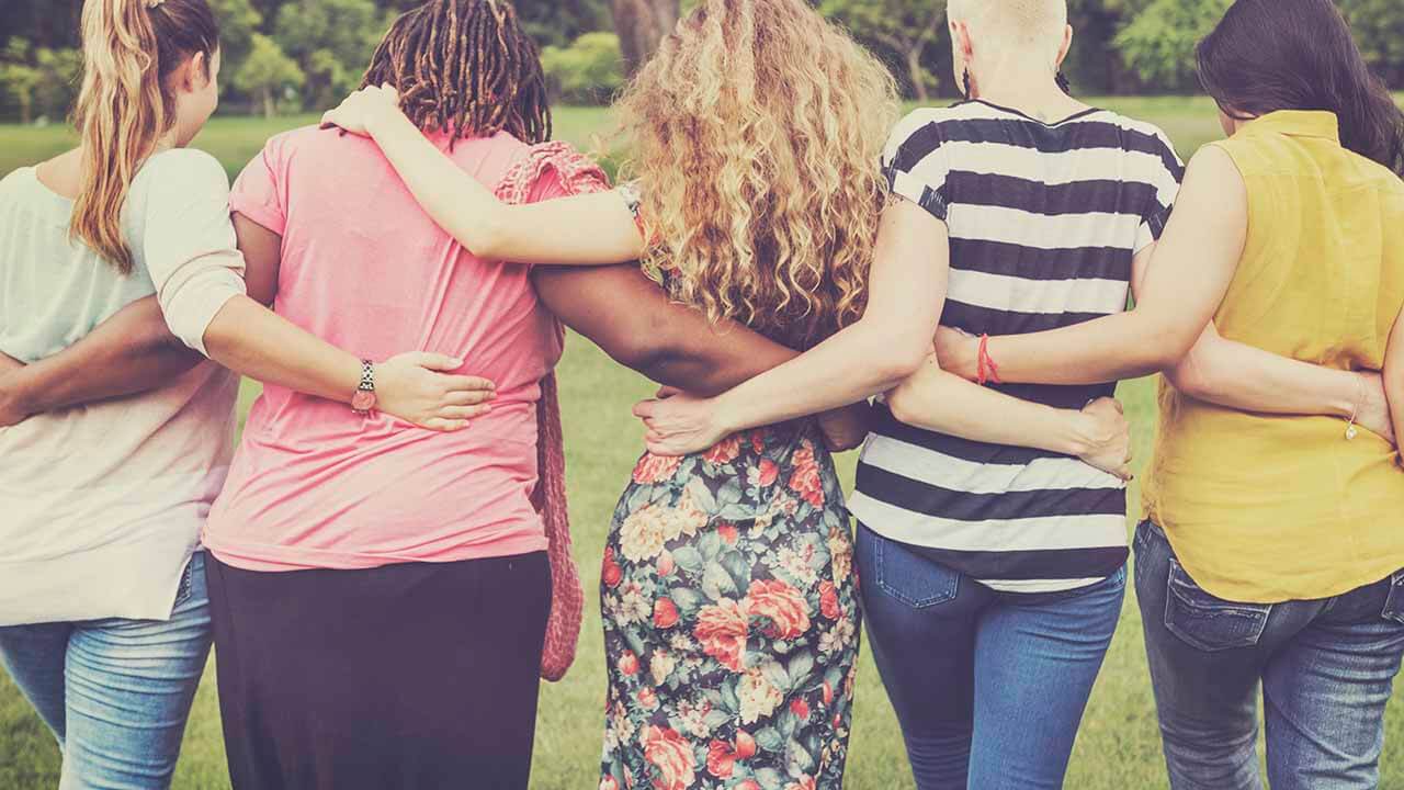 group of women with arms around eachother