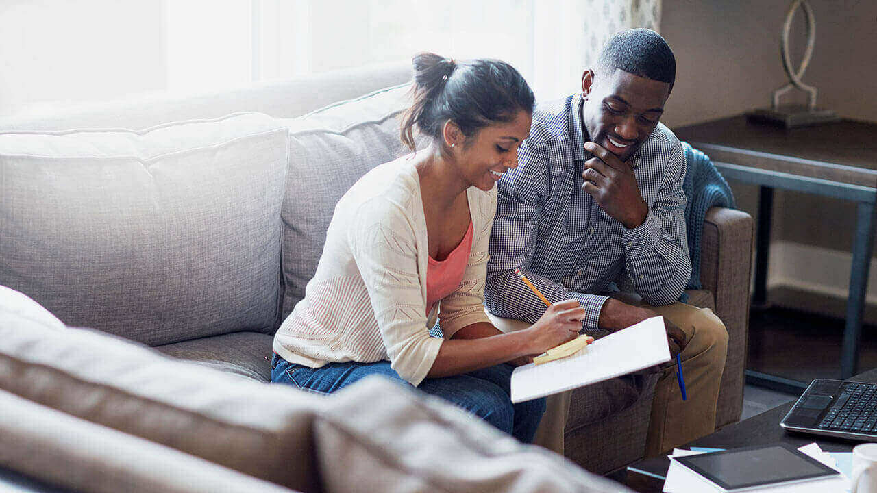 couple looking at piece of paper